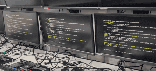 In-house testing at G2 Digital. Monitors displaying compliance test results.