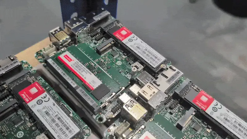 Twenty or more 1U NUC built-up motherboards ready for housing. 